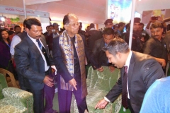 Mr. Sadik Mohammad Chowdhury, MD of L.A.I.D with Honorable Chief Minister of Assam Shri Tarun Gogoi at HSMM Group Kiosk on Inauguration Day of Assam International Trade & Industrial Fair, Jorhat, Assam, India on 19 Feb 2015.